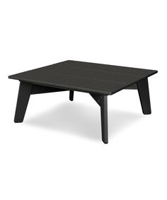 a black table sitting on top of a white floor