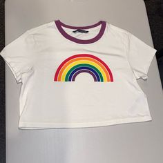 Never Worn But Tags Off. New Condition. Super Soft And Cute! Has A Vintage Look To It. Comes From A Smoke Fee And Pet Free Home. Comment If Any Questions! Open To Offers. Rainbow Fitted Crew Neck Top, Fitted Rainbow Crew Neck Top, Fitted Rainbow Print Short Sleeve Top, Fitted Rainbow Casual Top, Fitted Casual Rainbow Tops, Fitted Rainbow Short Sleeve Tops, Casual Fitted Rainbow Print Tops, Casual Fitted Top With Rainbow Print, Fitted Casual Tops With Rainbow Print