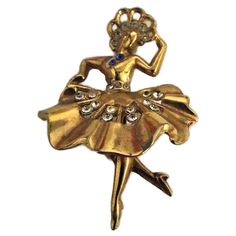 Dimensional Gold Vermeil Ballerina Rhinestone Brooch Gold vermeil figural ballerina brooch with clear and blue rhinestone accents. Unmarked Corocraft. Inven. 22.3 ITEM ID 714-11 COLOR Gold ITEM TYPE Vintage Heart Locket Necklace, Dress Clip, Antique Brooches, Bird Brooch, Heart Locket, Rhinestone Brooches, Blue Rhinestones, Cat Pin, Gold Texture