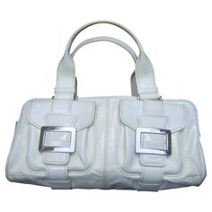 White Satchel With Silver-tone Hardware For Office, White Satchel With Silver-tone Hardware For Formal Occasions, White Shoulder Bag With Palladium Hardware For Office, White Formal Satchel With Silver-tone Hardware, Formal White Satchel With Palladium Hardware, Modern Rectangular Satchel With Buckle Closure, Modern White Satchel With Palladium Hardware, White Office Satchel With Silver-tone Hardware, White Bags With Buckle Closure For Everyday Use