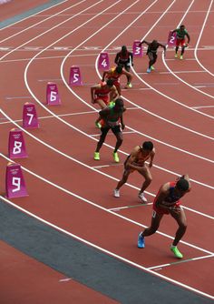 the athletes are competing in an indoor race