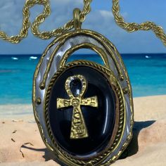 Women's History Month! Ancient Egyptian Ankh on a Black agate stone in a pendant. A gold plated Necklace #Afrocentric by straightpathjewelry on Etsy Ankh Pendant, Ancient Egyptian Symbols, Black Agate Stone, Egyptian Symbols, Egyptian Jewelry, The Nile, Womens History Month, Black Agate, Stone Gold