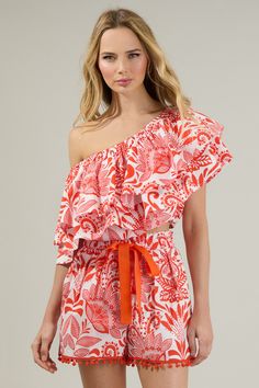 The Juny Floral Charmer One Shoulder Ruffle Top is calling your name! A tropical fun print highlights a single shoulder with exaggerated ruffle layers. The bodice maintains a cropped and voluminous fit with elastic casing along the bottom edge. Wear it with pants, sandals and your sunnies for a complete look! - Cropped- Ruffle layers- Elastic casing - One shoulder- Color: White RedSize + Fit - Model is 5'8" and wearing size XS- Measurements taken from size S - Chest: 35" - Length: 18" Fabric Sel Spring Vacation Crop Top With Ruffles, White Ruffled Crop Top For Vacation, Chic Ruffled Crop Top For Vacation, Off-shoulder Ruffled Top For Beach, Spring Floral Print One Shoulder Top, Summer Ruffled Crop Top For Vacation, Summer Crop Top With Ruffles For Vacation, Off-shoulder Ruffled Tops For Vacation, Off-shoulder Ruffle Tops For Vacation