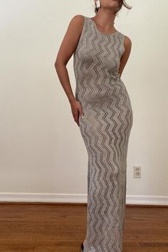 Sparkle and shine in our Silver Metallic Crochet Knit Dress! This stunning formal dress also doubles as a stylish cover-up. Its shiny, beautiful design will make you stand out and feel confident at any event. Make a statement with this must-have dress! Model is wearing a size small