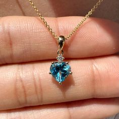 Materials: 14k White Gold or Yellow Gold Gemstone: Natural Mined Diamond and Natural Blue Topaz Total Diamond Carat Weight: 0.02 ct. Total Blue Topaz Carat Weight: 0.89 ct.  Pendant Diameter: 6.5mm x 13.5mm (including bale) Blue Topaz Stone Diameter: 6.5mm x 6mm Diamond Clarity and Color: SI1 H color Necklace: Adjustable 16 and 18 inches with a lobster clasp. Chain Weight: 0.6mm 1.35 grams Description: Option for pendant itself or with a 16 and 18 inch adjustable chain with a lobster clasp. These are natural mined diamonds and genuine blue topaz, these are not lab grown diamonds. A heart shaped blue topaz pendant with a natural diamond on top. Perfect pendant for everyday wear.  Feel free to message me with any questions! Heart Cut Topaz Jewelry Perfect For Gifts, Heart Cut Topaz Jewelry As Gift, Heart Cut Topaz Jewelry Gift, Heart Cut Topaz Jewelry For Gifts, Blue 14k Gold Heart Pendant Jewelry, Heart Cut Blue Topaz Birthstone Jewelry, Heart Cut Blue Topaz Jewelry For Gift, Heart Cut Blue Topaz Jewelry Gift, Heart-shaped Blue Topaz Birthstone Jewelry