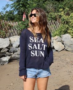 Soft, breathable and ropey cotton blend knit. This slightly cropped, boxy-fit crew features dropped shoulders for that perfect slouchy look. "Sea, Salt, Sun" is knit directly into the front. Long sleeves can be rolled for a more casual, beachy vibe. We love this paired over distressed denim for a boho, beachy look. Measurements for S/M: Width (1" down from armholes): 25" Length (from highest point shoulder to hem): 22" Composition: 60% cotton, 40% acrylic CARE All of our Wooden Ships Knits are M Boho Beachy, Unique Sweaters, Summer Sweaters, Beautiful Summer, Sea Salt, Distressed Denim, Salt, Graphic Sweatshirt, Cotton Blend