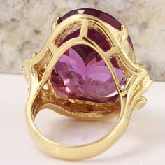 25.25 Carats Natural Amethyst and Diamond 14K Solid Yellow Gold Ring Suggested Replacement Value: $5,900.00 Total Natural Oval Shaped Amethyst Weights: 25.00 Carats (VVS) Amethyst Measures: 22.64 x 16.16mm Natural Round Diamonds Weight: .25 Carats (color G / Clarity VS2-SI1) Ring total weight: 15.2 grams Disclaimer: all weights, measurements and colors are approximate and may vary slightly from the listed dimensions or as seen in the image. All pictures are magnified to show the smallest of deta Purple Ruby Ring For Formal Occasions, Luxury Formal Hallmarked Gemstones, Exquisite Yellow Gold Amethyst Ring, Exquisite Yellow Gold Amethyst Ring With Accent Stones, Exquisite Gold Amethyst Ring For Formal Occasions, Purple Sapphire Ring With Prong Setting For Formal Occasions, Exquisite Gold Amethyst Ring, Formal Purple Ruby Ring, Elegant Purple Ruby Ring In 14k Gold