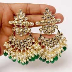 Bollywood Kundan Chaandbali Earrings/Indian Earrings/pearl Earring/Pakistani Earrings/Statement Earrings/Long chandelier/Indian wedding Length 3.3 inches Width 2.2 inches Arrives in a gift box Color, shades, texture displayed may slightly vary from the actual product due to digital image limitations. We request you to consider these minor variations. Please expect the possibility of some slight imperfections when buying handmade jewelry. If you have any questions, please contact us. Green Dangling Beads Earrings For Wedding, Green Pearl Drop Danglers For Wedding, Dangling Beads Bridal Earrings For Wedding And Festivals, Traditional Wedding Pearl Earrings With Dangling Beads, Dangling Pearl Earrings For Wedding And Festivals, Kundan Chandbali, Pakistani Earrings, Long Chandelier, Chandbali Earrings