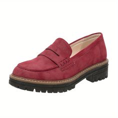 a woman's red loafer shoe with black soles