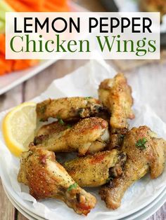 lemon pepper chicken wings on a plate with carrots and celery in the background