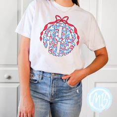 Unleash your wild side with our Red, White and Blue Leopard Monogram Tee! Featuring a playful mix of colors and patterns, this women's tee is perfect for adding a touch of fun to any outfit. Plus, with a monogram and bow detail, you can show off your individual style. Tees run true to size. If you have any questions please feel free to ask. Fabric & Care:Machine wash warm or cold with mild detergentDry on normal dryer settingsDo not dry cleanDo not iron over design. If ironing is needed iron on Spring Casual T-shirt With Monogram Print, Monogram Print Relaxed Fit Short Sleeve Top, Relaxed Fit Monogram Print Short Sleeve Tops, Casual Short Sleeve Tops With Monogram Print, Trendy Cotton Tops With Monogram Print, Relaxed Fit Monogram Print Summer Tops, Casual Monogram Print T-shirt For Spring, Casual Tops With Monogram Print For Spring, Casual Monogram Print Tops For Spring