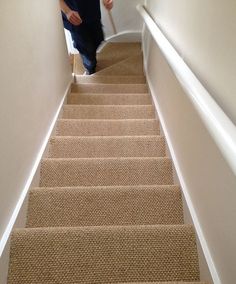 a person walking up some stairs in a house