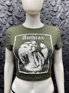 This is an Anthrax cropped forest green screen printed short sleeved top. This has the Anthrax Image screen printed on the front. 57% Cotton/ 38% polyester/ 5% spandex These are handmade screenprinted and slightly vary from the photo. Please feel free to email me any questions. Thanks for looking. I do not do exchanges and I do not take returns unless the item is damaged. I thoroughly check each item before it is shipped out. The seller is not responsible for any lost or stolen packages. Green Punk Style T-shirt For Streetwear, Fitted Green Crop Top With Graphic Print, Grunge Cropped T-shirt With Graphic Print, Spring Punk Style Graphic Print Crop Top, Spring Punk Crew Neck Crop Top, Punk Graphic Print Crop Top For Spring, Spring Punk Crop Top With Graphic Print, Spring Punk Style Crew Neck Crop Top, Spring Punk Crop Top With Crew Neck