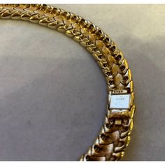 This is part of Chairish’s Costume Jewelry assortment.  A magnificent and weighty gold-tone and white enameled Ciner choker/collar, ca. late 1950s/early 1960s.  This choker belonged to a notable costume jewelry industry professional, who worked for Trifari.  Ciner jewelry was founded in New York City in 1892 as a fine jeweler and this family-owned operation is still in business today!  Since 1931, the company has produced fine costume jewelry. Luxury Formal Choker With 17 Jewels, Luxury Yellow Gold Choker For Formal Events, Formal Luxury Choker With 17 Jewels, Yellow Gold Formal Costume Jewelry Chain Necklace, Formal Yellow Gold Costume Jewelry Chain Necklace, Yellow Gold Formal Chain Necklace, Vintage Gold Round Choker, Vintage Gold Choker For Formal Occasions, Luxury Gold Evening Choker