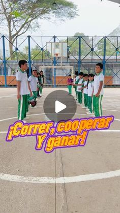 a group of young men standing on top of a basketball court