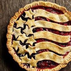 an american flag pie sitting on top of a wooden table