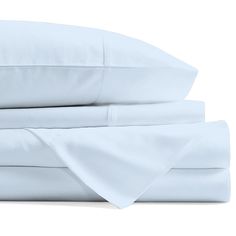 the sheets and pillowcases are neatly folded on top of each other in white