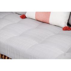 the mattress is made up and ready to be used as a sofa or bed frame