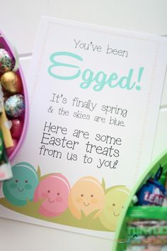 an easter greeting card with candy and candies in the bowl next to it is a sign that says, you've been egged it's finally spring