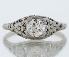 Antique White Diamond Platinum Ring, Antique White Diamond Ring In Platinum, Antique White Platinum Diamond Ring, White Platinum Diamond Ring For Marriage, Vintage White Diamond Filigree Ring, Ornate Brilliant Cut Diamond Ring For Wedding, Ornate Brilliant Cut Diamond Wedding Ring, Ornate Wedding Diamond Ring With Brilliant Cut, White Heirloom Filigree Ring With Prong Setting