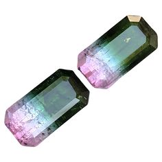 two large green and pink crystals on white background with clippings to the side