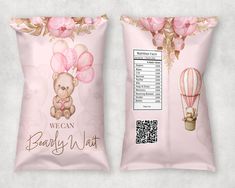 two bags of candy with pink flowers on them and a brown teddy bear holding balloons