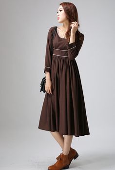 "Slip into this chocolate brown dress and focus on having a great time with comfortable ease . This midi linen dress is crafted with soft linen with round neckline, bracelet length sleeves, and the empire waist silhouette of this flattering and feminine dress will make you every move down the imagainary red carpet an opportunity to be admired. DETAIL * Brown linen Fabric * Hidden zipper Closure in the right side * Bracelet length sleeve * Contrast Piping detail * Empire waist dress * Round neckl Midi Linen Dress, Chocolate Brown Dress, Linen Midi Dress, Wool Clothing, Dress Linen, Empire Waist Dress, Empire Dress, Brown Vintage, Feminine Dress