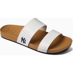 Enjoy a fun day under the sun in these Cushion Vista sandals from REEF. Designed with subtle yet striking New York Yankees details, these slides are perfect for poolside fun or game day festivities. The contoured footbed maximizes comfort, helping you feel your best as you rep the New York Yankees.Enjoy a fun day under the sun in these Cushion Vista sandals from REEF. Designed with subtle yet striking New York Yankees details, these slides are perfect for poolside fun or game day festivities. Th Keds Triple Kick, Double Strap Sandals, Navy Flowers, Glitter Sneakers, Buckle Sandals, Fun Day, New York Yankees, Slip On Sneakers, Blue Stone