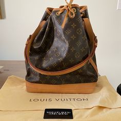 Vintage Louis Vuitton Noe Bag. This Is Vintage Bag From 1995 And Does Not Have The Tag Inside The Bag. However It Does Have Proof Of Authenticity With The Card From What Goes Around Comes Around. There Are Some Water Stains On The Bottom Of The Bag And Around The Top Edge. Nothing Super Noticeable Unless You Really Look For It. Otherwise In Great Condition. The Shoulder Strap Is Perfect. Stored In The Cloth Bag (And I Have Never Used It). Date Code Ar0925 - Last Picture. (I Had To Watch A Video Designer Brown Bag With Original Box, Travel Bag In Monogram Canvas With Original Box, Luxury Pre-owned Travel Shoulder Bag, Designer Monogram Canvas Bucket Satchel Bag, Designer Everyday Luxury Bags In Coated Canvas, Designer Monogram Canvas Bucket Tote Bag, Signature Coated Canvas Bucket Travel Bag, Classic Bucket Bag In Monogram Canvas, Brown Coated Canvas Bag For Everyday Luxury