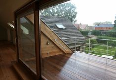 an open window with a view of a house