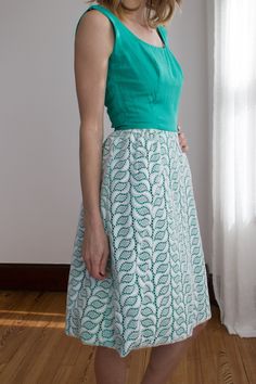 "1960's sleeveless cocktail or party dress. The bodice is made in a textured fabric that looks a bit like raw silk or linen, but I think it's probably a polyester or cotton blend. Scooped neckline and low back. The skirt has a lace overlay. Back metal zipper. Bra strap tabs on the inside of the straps that snap closed. There are also straps in the back to hold the band down! There are very neat little touches that I rarely see. *Condition* Good vintage condition. Stains on the inside of the stra Green Cocktail Dress, Green Cocktail, Bra Strap, Scooped Neckline, Wiggle Dress, New Market, Bra Straps, Dress Party, Metal Zipper