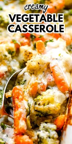 a spoon full of vegetable casserole on top of a white plate with broccoli and carrots