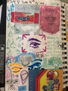 an open notebook covered in lots of stickers