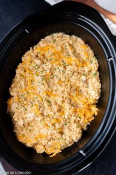 a crock pot filled with food sitting on top of a table