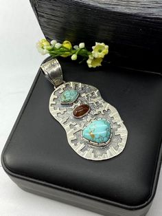 Artisan Turquoise and Mexican fire Opal pendant Hand-made Sterling Silver 925.  Stones used: Turquoise (Nevada), Mexican Fire Opal.  Height -3” (including bail), Width – 1 1/4”  Height – 75mm (including bail), Width – 35mmUnique Handcrafted One-of a-kind Design PendantEach Piece of Jewelry in my Collection is Absolutely One of a Kind!When you start wearing a piece of my jewelry you will fall in love with it more and more each day and feel that good Energy and Love that I pass into it while creat Unique Untreated Turquoise Necklace Gift, Turquoise Pendant In Sterling Silver, Turquoise Pendant Necklace With Natural Stones, Turquoise Sterling Silver Pendant Gemstone, Unique Untreated Turquoise Necklace As Gift, Turquoise Pendant Gemstone In Sterling Silver, Unique Untreated Turquoise Necklace For Gift, Southwestern Pendant Jewelry With Gemstones, Unique Untreated Turquoise Pendant Necklace