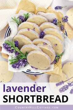 lavender shortbreads on a plate with flowers and crackers in the background text overlay reads lavender shortbread