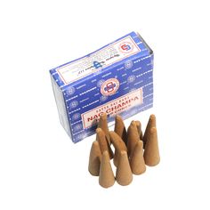 small wooden cones are sitting in front of a box