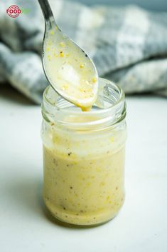 a spoon with some food in it on a table