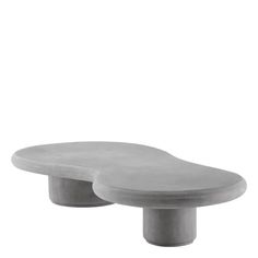 two concrete tables sitting next to each other on a white background, one is shaped like an oval