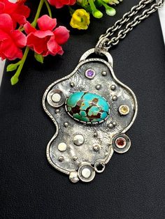 "ARTISAN ROYSTON TURQUOISE PENDANT comes with 20\" chain Hand-made Sterling Silver 925. Stones used: Royston Turquoise, Green Tourmaline, Sapphire, Amethyst. Height -2 1/2\" (with bail), Width - 1 3/4\" Height - 62mm, width-45mm. Unique Handcrafted One-of a-kind Design Pendant. Each Piece of Jewelry in my Collection is Absolutely One of a Kind! When you start wearing a piece of my jewelry you will fall in love with it more and more each day and feel that good Energy and Love that I pass into it Unique Silver Turquoise Necklace, Artistic Turquoise Necklace With Large Pendant, Artistic Turquoise Jewelry With Unique Variations, Unique Silver Turquoise Necklace With Gemstone, Handmade Fusion Turquoise Jewelry, Handmade Turquoise Fusion Jewelry, Unique Turquoise Sterling Silver Necklace, Unique Handmade Round Turquoise Necklace, Unique Handmade Oval Turquoise Necklace