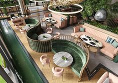 an aerial view of a restaurant with tables, chairs and couches on the ground