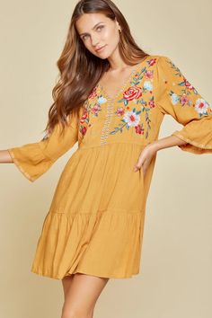 Fall V-neck Dress With Embroidered Hem, Bohemian Dresses With Floral Embroidery And 3/4 Sleeves, Floral Embroidered V-neck Dress For Brunch, V-neck Floral Embroidered Dress For Brunch, Casual Embroidered Dress With 3/4 Sleeves, Yellow Embroidered V-neck Dress, Embroidered V-neck Mini Dress For Brunch, Spring V-neck Dress With Embroidered Neckline, Spring V-neck Embroidered Dress