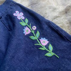 "60s 70s era true vintage dark blue denim shorts with embroidered floral details 🍒🌼 such a perfect pair of shorts we've had this in are archives for a minute and they need to be adored by someone special 🌼🍒 waist 29\" hips 38\" rise 12\" length 13\"" Vintage Floral Embroidered Bottoms For Summer, Vintage Embroidered Summer Bottoms, Denim Blue Cotton Bottoms With Floral Embroidery, Denim Blue Floral Embroidered Cotton Bottoms, Retro Wide Leg Cotton Shorts, Embroidered Dark Wash Bottoms For Summer, Dark Wash Embroidered Bottoms For Summer, Spring Cotton Dark Wash Shorts, Vintage High-waisted Jean Shorts For Spring