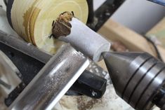 a piece of wood being worked on by a machine