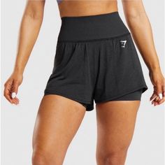 Comfortable And Stylish Black High-Waisted Athletic Shorts Perfect For Workouts. Made By Gymshark. 1 Pair Of Shorts. 2 Layers. All The Possibilities. The Vital Seamless 2.0 2-In-1 Shorts Feature An Inner Layer Made From The Classic Seamless, Sweat-Wicking Fabric In The Rest Of The Vital Seamless Collection. Then, We've Added An Extra Layer Made From A Brand New, Lightweight Fabric For Better Breathability In Those High Sweat Sessions. And, Thanks To The Looser Fit Of The Outer Layer, You Get A L Gymshark Shorts, Gymshark Vital Seamless, Gymshark Black, Gymshark Women, Cycling Shorts, Gym Shorts, Sweat Shorts, Shorts With Tights, High Rise Shorts