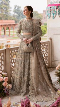 a woman in a beige lehenga