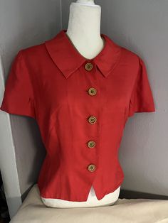 Name: Vintage Short Sleeved Red Blouse  Brand: Donna Morgan Size: 8 Measurements:22 " L 21" W Fabric: 100% silk  *Note: black mark on sleeve ** Red Semi-formal Top, Silk Tops For Semi-formal Summer Occasions, Casual Silk Blouse With Buttons, Red Silk Blouse For Formal Occasions, Formal Red Silk Tops, Silk Office Top With Collar, Spring Semi-formal Silk Tops, Office Silk Top With Collar, Red Silk Blouse For Spring