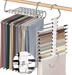 an over the door rack with clothes hanging from it's sides and two hooks on each side