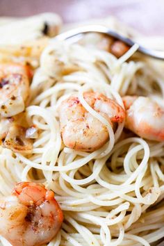 pasta with shrimp and garlic sauce in a white bowl