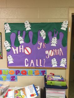 a bulletin board with purple and green writing on it